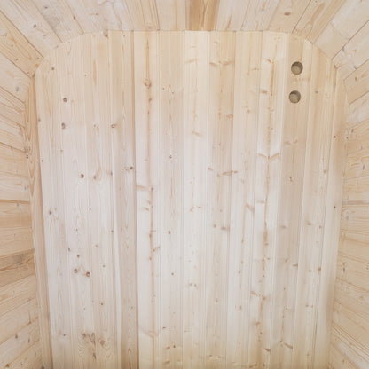 Wooden sauna with light wood paneling