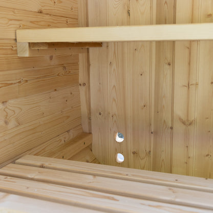 Wooden sauna interior with bench and shelves.